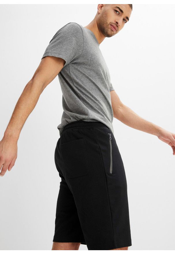 bonprix - Bermudy dresowe z praktycznymi kieszeniami na zamek. Kolor: czarny. Materiał: dresówka