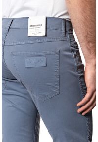 Wrangler - WRANGLER SPODNIE MĘSKIE GREENSBORO FLINSTONE BLUE W15QMM13F. Materiał: materiał #7