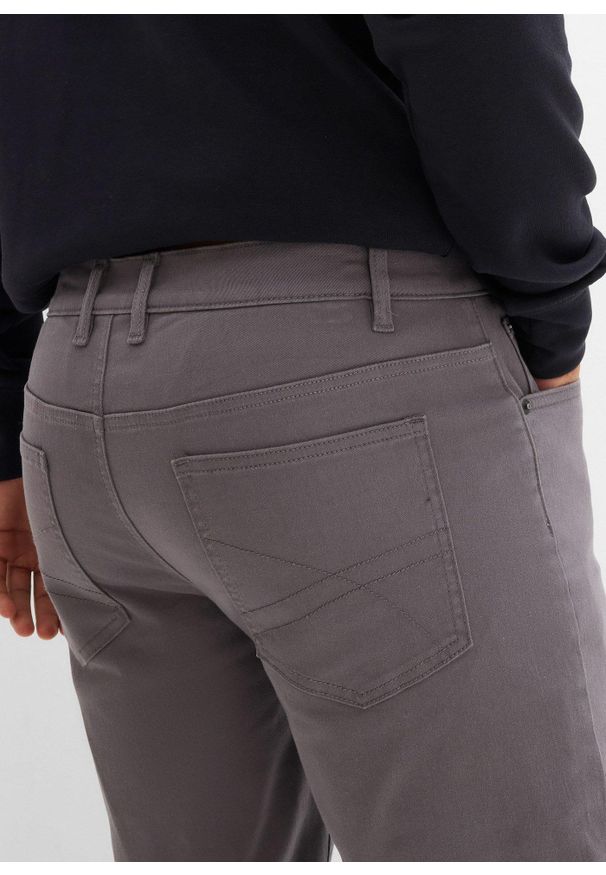 bonprix - Spodnie ocieplane ze stretchem o kroju regular fit, z puszystą flanelową podszewką, straight. Stan: podwyższony. Kolekcja: plus size. Kolor: szary. Materiał: elastan