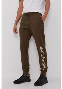 columbia - Columbia - Spodnie. Kolor: zielony. Materiał: dzianina. Wzór: gładki