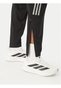 Adidas - adidas Spodnie dresowe Astro KC4947 Czarny Regular Fit. Kolor: czarny. Materiał: syntetyk #3