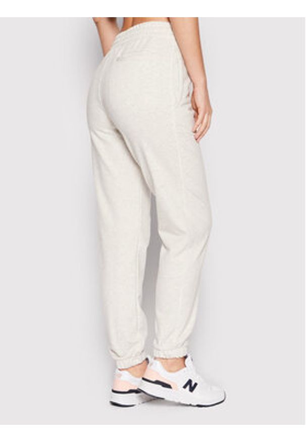 New Balance Spodnie dresowe Unisex UP21500 Szary Ahletic Fit. Kolor: szary. Materiał: syntetyk