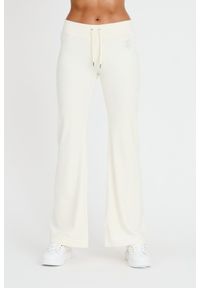 Juicy Couture - JUICY COUTURE Spodnie ecru Rodeo Layla Pant. Kolor: beżowy. Materiał: dresówka