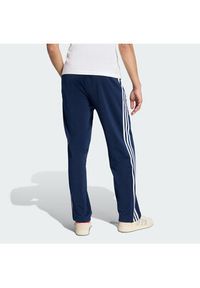 Adidas - adidas Spodnie dresowe Firebird KD8316 Granatowy Loose Fit. Kolor: niebieski. Materiał: syntetyk #4