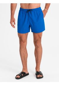Ombre Clothing - Neonowe męskie szorty kąpielowe z efektem magic print – niebieskie V3 OM-SRBS-0147 - XXL. Kolor: niebieski. Materiał: poliester. Długość: krótkie. Wzór: nadruk. Styl: wakacyjny #1