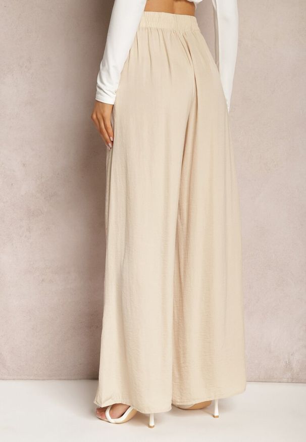 Renee - Beżowe Letnie Spodnie o Szerokim Fasonie z Gumką w Talii Philomen. Kolor: beżowy. Sezon: lato