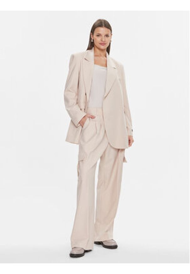 Herskind Spodnie materiałowe Louise 5011993 Beżowy Relaxed Fit. Kolor: beżowy. Materiał: syntetyk