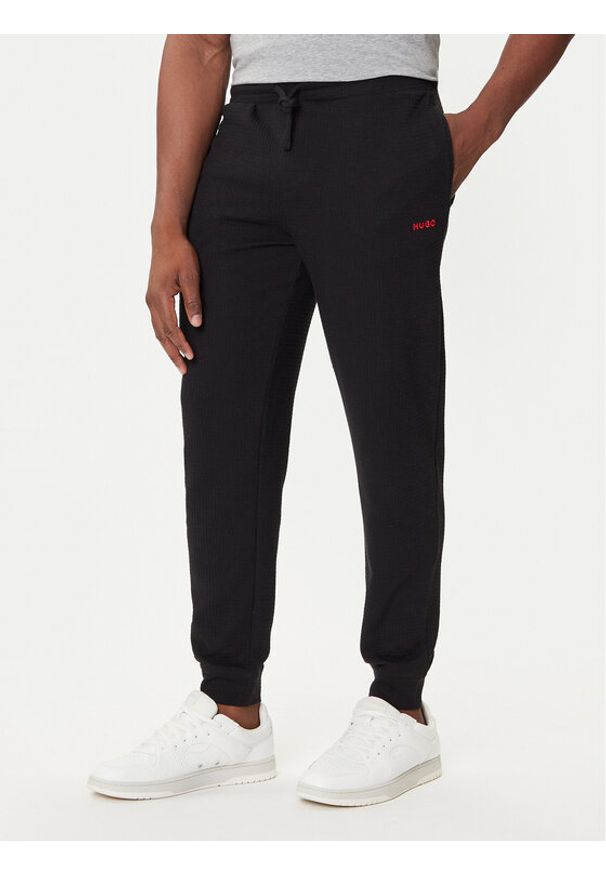 Hugo - HUGO Spodnie dresowe Austin 50532012 Czarny Regular Fit. Kolor: czarny. Materiał: bawełna, syntetyk