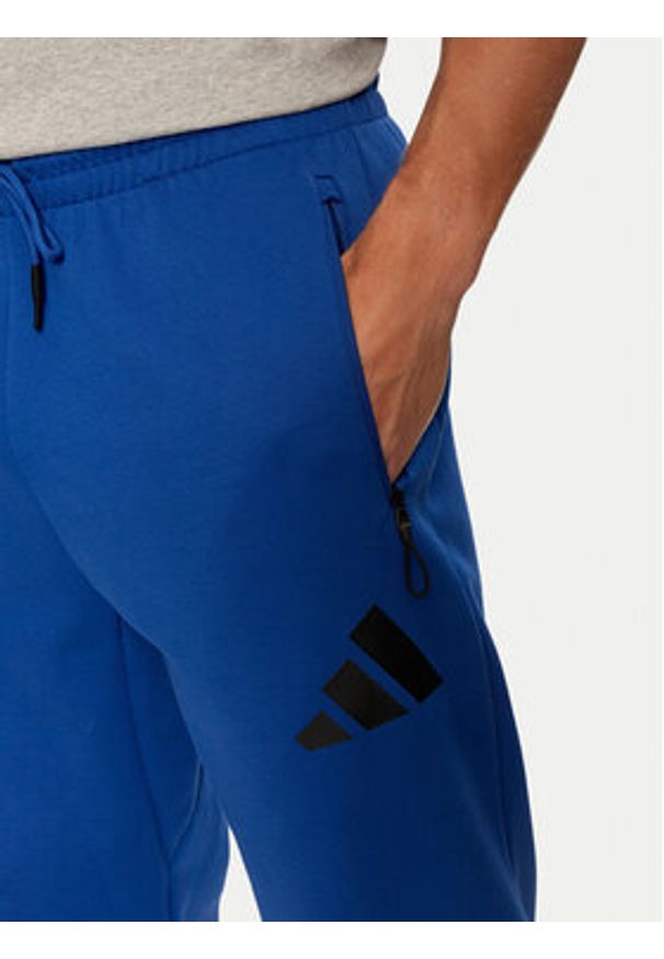 Adidas - adidas Spodnie dresowe Z.N.E. JF6541 Niebieski Regular Fit. Kolor: niebieski. Materiał: bawełna, syntetyk