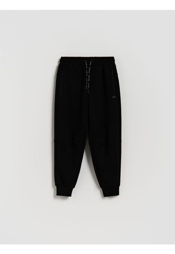 Reserved - Dzianinowe spodnie - czarny. Kolor: czarny. Materiał: dzianina