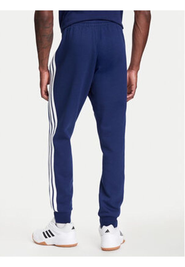 Adidas - adidas Spodnie dresowe Essentials 3-Stripes JD1859 Niebieski Regular Fit. Kolor: niebieski. Materiał: bawełna