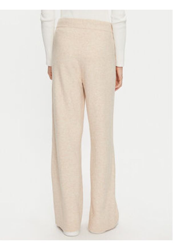 TOMMY HILFIGER - Tommy Hilfiger Spodnie dzianinowe UW0UW05523 Beżowy Relaxed Fit. Kolor: beżowy. Materiał: syntetyk