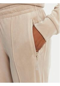 Juicy Couture Spodnie dresowe Tina JCAPW045 Beżowy Regular Fit. Kolor: beżowy. Materiał: syntetyk
