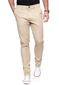 Wrangler - WRANGLER SPODNIE MĘSKIE CHINO CAMEL WASHED W16LHE49J. Materiał: materiał