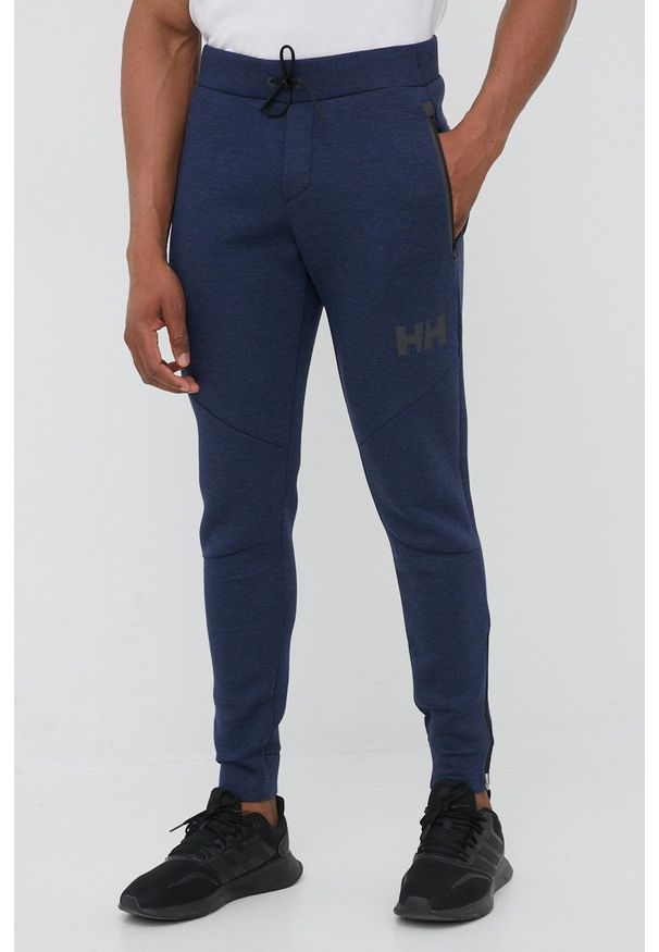 Helly Hansen spodnie męskie kolor szary gładkie. Kolor: niebieski. Materiał: materiał, włókno. Wzór: gładki
