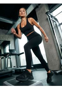 Sinsay - Legginsy sportowe - czarny. Kolor: czarny. Styl: sportowy #1