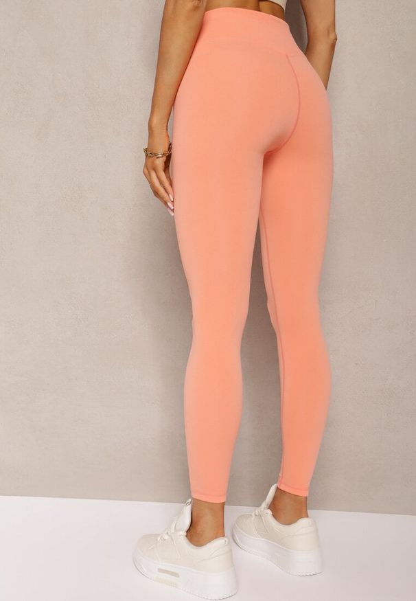 Renee - Pomarańczowe Sportowe Legginsy High Waist Quarefia. Stan: podwyższony. Kolor: pomarańczowy. Materiał: dzianina, materiał. Długość: długie. Styl: sportowy