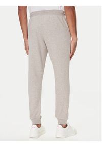 TOMMY HILFIGER - Tommy Hilfiger Spodnie dresowe UM0UM03664 Beżowy Regular Fit. Kolor: beżowy. Materiał: syntetyk #5