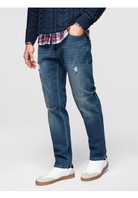 Ombre Clothing - Męskie spodnie jeansowe REGULAR FIT z przetarciami - ciemnoniebieskie V2 - Rozmiar: L. Okazja: na co dzień, na uczelnię. Kolor: niebieski. Materiał: jeans. Wzór: aplikacja. Styl: casual, klasyczny #1