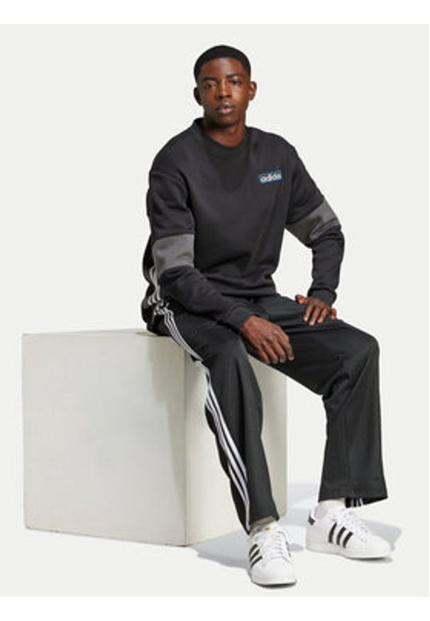 Adidas - adidas Spodnie dresowe adicolor Firebird IZ4801 Czarny Baggy Fit. Kolor: czarny. Materiał: syntetyk, bawełna