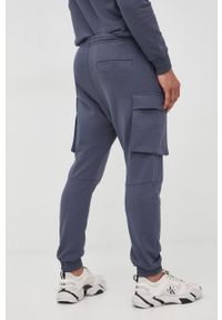 G-Star RAW - G-Star Raw spodnie dresowe męskie kolor granatowy gładkie. Kolor: niebieski. Materiał: dresówka. Wzór: gładki