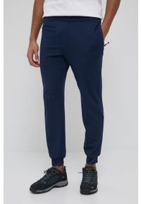 columbia - Columbia spodnie dresowe Tech Trail męskie kolor granatowy gładkie. Kolor: niebieski. Materiał: dresówka. Wzór: gładki
