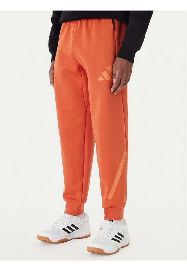 Adidas - adidas Spodnie dresowe Z.N.E. KE4686 Pomarańczowy Regular Fit. Kolor: pomarańczowy. Materiał: bawełna