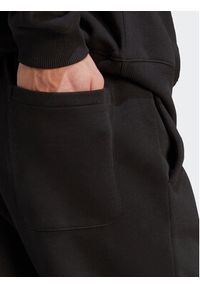 Adidas - adidas Spodnie dresowe All SZN Fleece IB4070 Czarny Regular Fit. Kolor: czarny. Materiał: bawełna #6