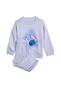 Adidas - Zestaw adidas Disney Lilo & Stitch Jogger Kids. Kolor: fioletowy, różowy, wielokolorowy. Wzór: motyw z bajki. Styl: młodzieżowy