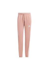Adidas - Spodnie Essentials 3-Stripes French Terry Cuffed. Kolor: różowy, biały, wielokolorowy. Materiał: materiał. Sport: fitness