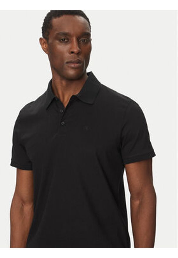 Calvin Klein Jeans Polo LV040HM281 Czarny Regular Fit. Typ kołnierza: polo. Kolor: czarny. Materiał: bawełna, syntetyk
