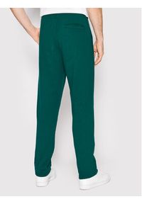 Adidas - adidas Spodnie dresowe adicolor Spinner HC4494 Zielony Regular Fit. Kolor: zielony. Materiał: dresówka, bawełna