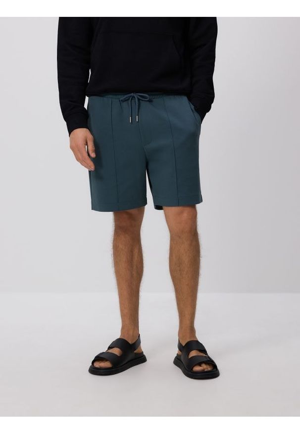 Reserved - Szorty comfort z przeszyciami - granatowy. Kolor: niebieski. Materiał: bawełna, dzianina