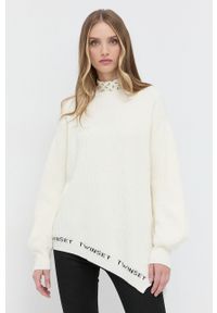 TwinSet - Twinset Sweter damski. Kolor: beżowy. Materiał: dzianina. Długość rękawa: długi rękaw. Długość: długie