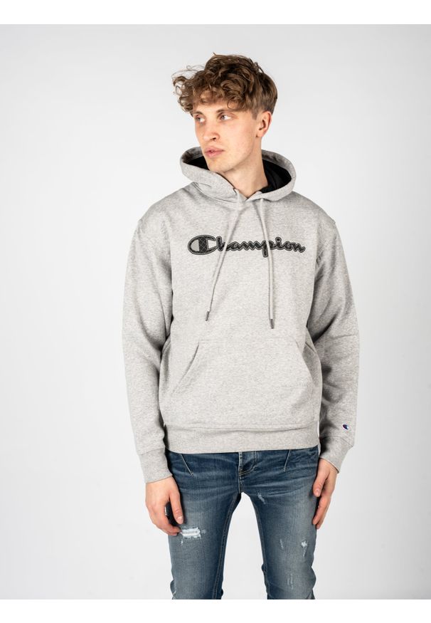 Champion Bluza "Hoodie" | HBGF89H586N9A | Mężczyzna | Szary. Okazja: na co dzień. Typ kołnierza: kaptur. Kolor: szary. Materiał: poliester, bawełna. Wzór: aplikacja. Styl: casual