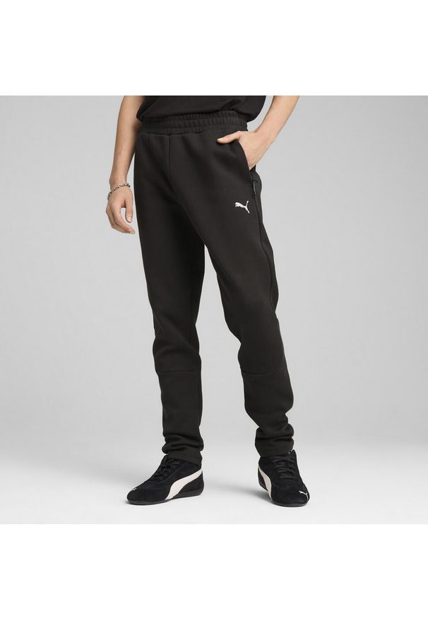 Puma - Męskie spodnie EVOSTRIPE PUMA Black. Kolor: czarny. Materiał: dresówka. Sport: piłka nożna