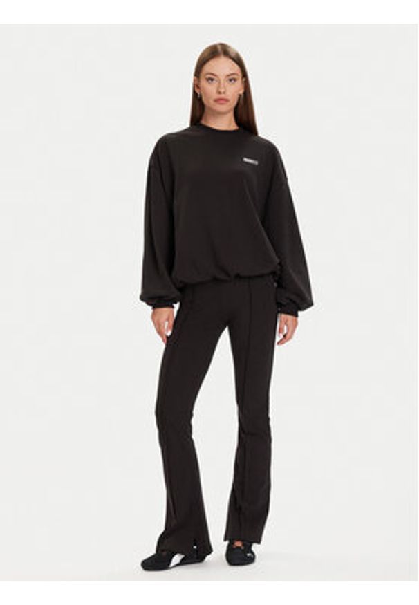 Puma Spodnie dresowe PUMA X ROSÉ 635156 01 Czarny Slim Fit. Kolor: czarny. Materiał: bawełna