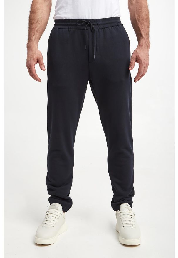 Emporio Armani - Spodnie dresowe męskie EMPORIO ARMANI. Materiał: dresówka