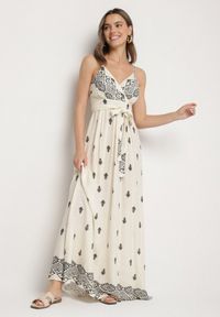 Born2be - Kremowo-Czarna Bawełniana Sukienka Rozkloszowana z Kopertowym Dekoltem i Wiązaniem Revevra. Okazja: na co dzień, na randkę. Typ kołnierza: dekolt kopertowy. Kolor: beżowy. Materiał: bawełna. Długość rękawa: na ramiączkach. Typ sukienki: kopertowe. Styl: casual #5