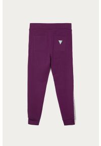 Guess Jeans - Spodnie dziecięce 116-175 cm. Kolor: fioletowy. Materiał: bawełna, jeans, dzianina, elastan. Wzór: aplikacja #2