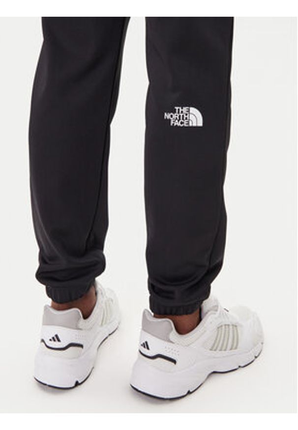 The North Face Spodnie dresowe Reaxion 2.0 NF0A8DRS Czarny Regular Fit. Kolor: czarny. Materiał: syntetyk
