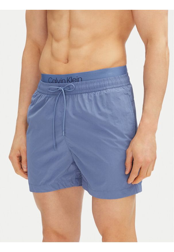 Calvin Klein Swimwear Szorty kąpielowe KM0KM01104 Niebieski Regular Fit. Kolor: niebieski. Materiał: syntetyk