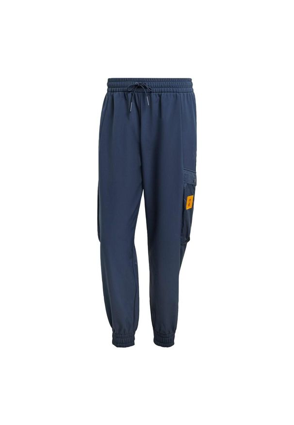 Adidas - Spodnie Real Madrid Seasonal Cargo. Kolor: niebieski. Materiał: materiał. Sport: piłka nożna
