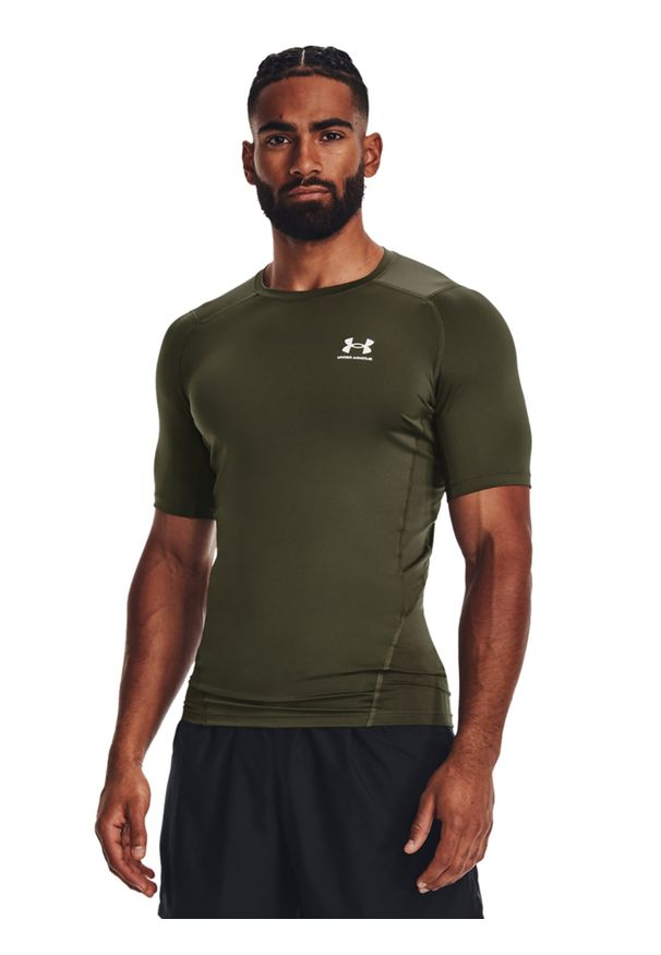 Koszulka treningowa męska Under Armour UA Hg Armour Comp Ss - oliwkowa/khaki. Kolor: oliwkowy, brązowy, wielokolorowy. Materiał: tkanina, poliester, elastan. Długość rękawa: raglanowy rękaw