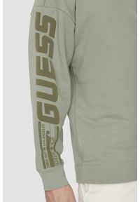 Guess - GUESS Zielona bluza męska Dalim Over z kapturem. Typ kołnierza: kaptur. Kolor: zielony