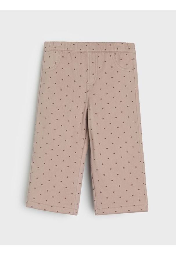Sinsay - Jeansy z polarem wewnątrz w groszki - różowy. Kolor: różowy. Materiał: jeans, polar. Wzór: grochy