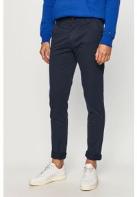 Tommy Jeans - Spodnie. Kolor: niebieski. Materiał: tkanina, bawełna, elastan. Wzór: gładki #1