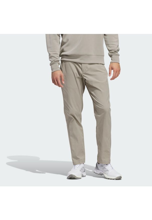 Adidas - Spodnie Ultimate365 Chino. Kolor: beżowy. Materiał: materiał. Sport: golf