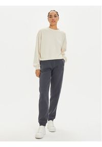 Calvin Klein Jeans Spodnie dresowe Monologo J20J223590 Szary Relaxed Fit. Kolor: szary. Materiał: syntetyk, bawełna