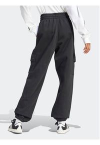 Adidas - adidas Spodnie dresowe Essentials IT7576 Czarny Loose Fit. Kolor: czarny. Materiał: bawełna #3